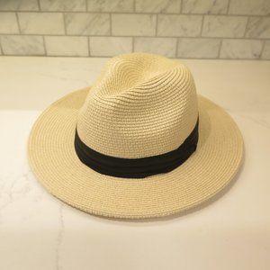 Wide-rimmed summer hat with black ribbon.